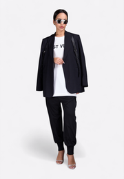 Model wearing black leather belted blazer, front-side view – East Vibe